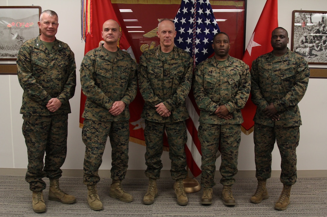 CAMP HUMPHREYS, Republic of Korea – Col. Sekou S. Karega, Camp Mujuk commanding officer, and 1st Sgt. Eric J. Thompson, Camp Mujuk senior enlisted advisor, visits Maj. Gen. Patrick J. Hermesmann, U.S. Marine Corps Forces Korea commander, and the MARFORK command team here, Nov. 29. Camp Mujuk is the only USMC installation in Korea.  Mujuk, meaning invincible, was the nickname earned by U.S. and R.O.K Marines who fought at Dosol Mountain during the Korean War. (Official Marine Corps photo by Sgt. Nathaniel Hanscom/Released)