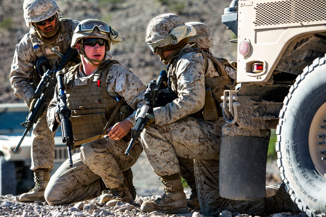 U.S. Marines prepare to set up security during a live-fire recovery mission on Camp Wilson, Marine Corps Air Ground Combat Center Twentynine Palms, California, Nov. 9, 2018, as part of the Integrated Training Exercise 1-19. Marines with Transportation Services Company, Combat Logistics Battalion 4, 3rd Marine Logistics Group, trained to recover damaged vehicles and personnel during combat operations. ITX 1-19 is a large-scale Marine Air-Ground Task Force integration exercise in which CLB-4 Marines and Sailors train to respond quickly to any contingency by fully integrating with ground and air combat elements of the MAGTF. (U.S. Marine Corps photo by Cpl. Joshua Pinkney)