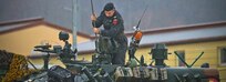 Romania Army CW2 Miron Alexandra installs a radio antenna on a TR-85 tank, Hohenfels, Germany, Dec. 2, 2018