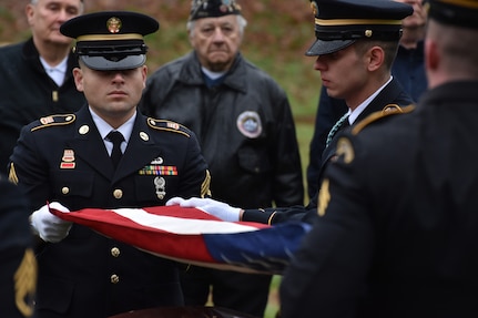 New York Army National Guard Soldiers in the Honor Guard fold the U.S. flag during a funeral service for Pfc. John Martin in Schuylerville, N.Y., Dec. 2, 2018. Martin had gone missing in action during the Korean War at the battle of Chosin Reservoir. His family finally received his body after 68 years as listed missing.