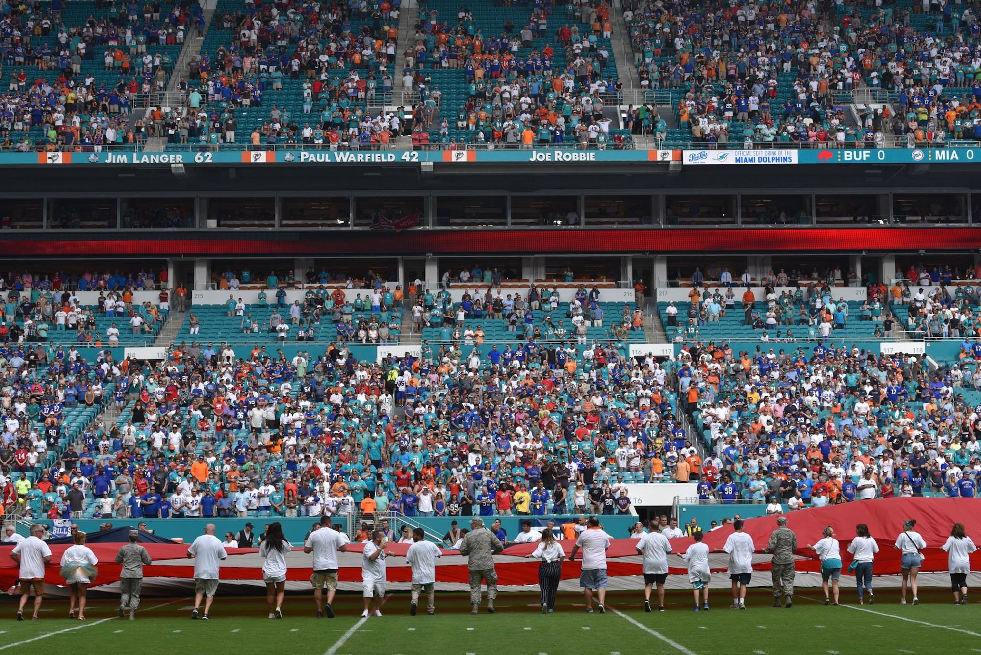 45th SW Airmen unfurl flag at Miami Dolphins game > Space Launch Delta 45 >  Article Display