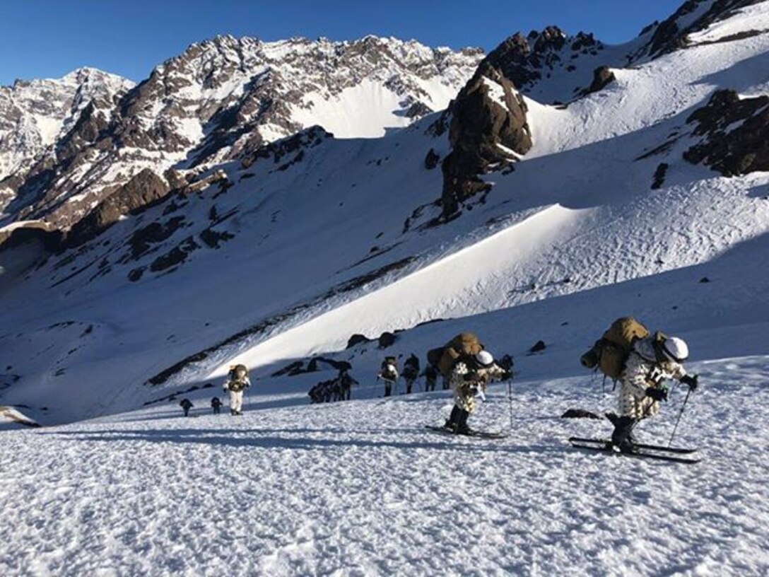 Students at the Chilean Mountain Warfare School ski uphill carrying their combat gear in the Chilean Andes as part of the winter portion of the course.