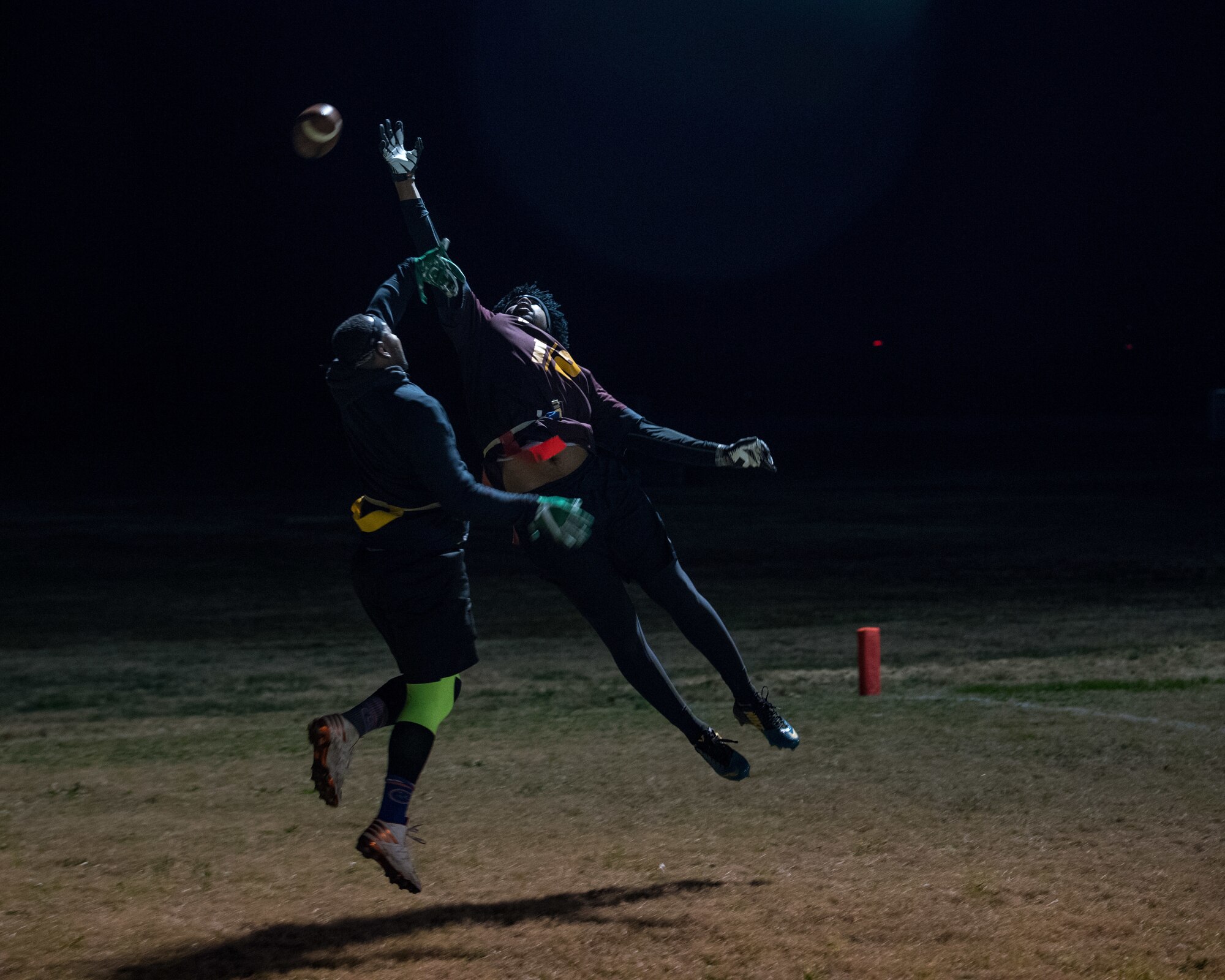Players assigned to the 633rd Medical Group and 27th Intelligence Squadron battle for the football during the intramural flag-football championship at Joint Base Langley-Eustis, Virginia, Nov. 27, 2018.