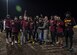 U.S. Air Force Col. Erin Cluff, 633rd Mission Support Group commander, hands the championship trophy to Airmen assigned to the 27th Intelligence Squadron during the intramural flag-football championship at Joint Base Langley-Eustis, Virginia, Nov. 27, 2018.