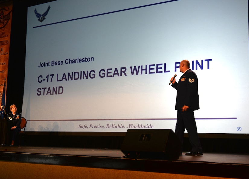 TSgt. Alex Aguayovirella presents his unit's innovation idea at the first-ever Phoenix Spark Tank competition at the 2018 Air Mobility Command and Airlift/Tanker Association Symposium in Grapevine, Texas Oct. 26, 2018. Aguayovirella and his team at the 437th Maintenance Squadron were one of four finalists in the competition for their development of a C-17 landing gear wheel paint stand.