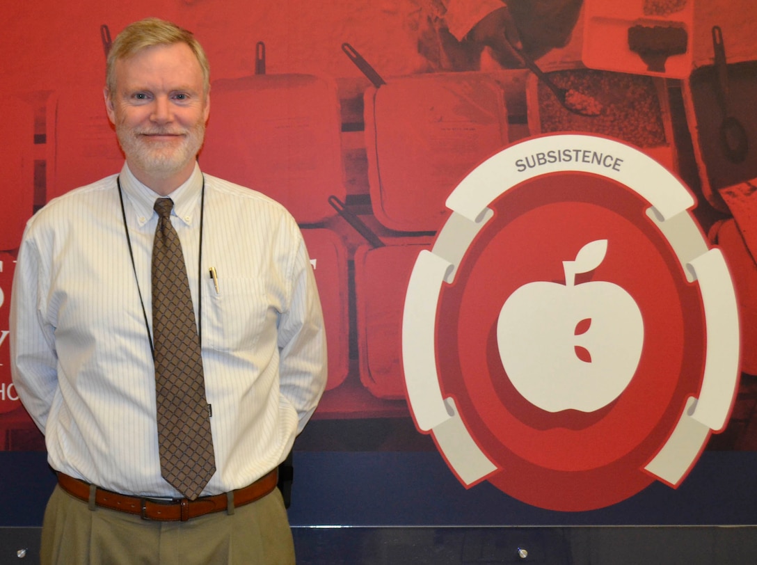 John Sheehan, DLA Troop Support Subsistence supply chain, customer operations director and almost 20-year cancer survivor pose for a photo to commemorate the final days of No Shave November, Nov. 28, 2018 in Philadelphia.  No Shave November is an annual campaign to bring awareness to cancer and encourage participants to donate the money typically used for shaving supplies to a local charity.