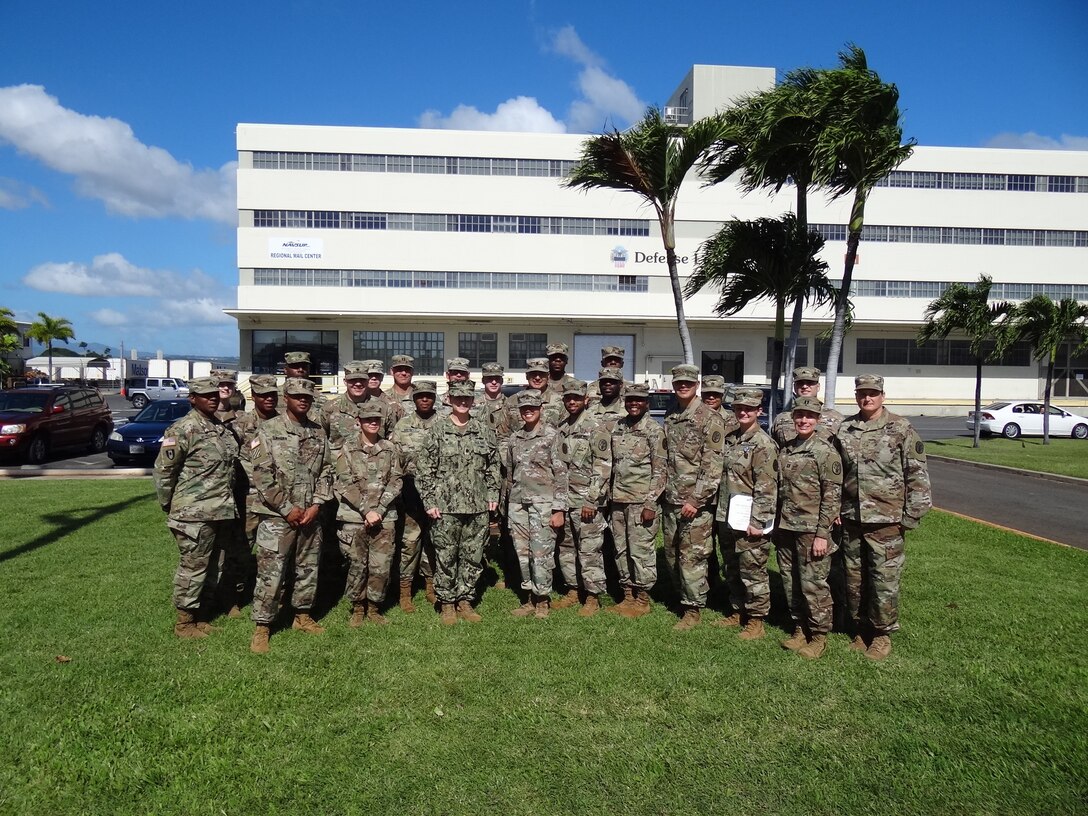Navy Cmdr. Shani LeBlanc, DLA Troop Support Pacific commander, pose with Soldiers from the Public Health Activity Hawaii, Schofield Barracks after presenting them awards for their contributions to RIMPACT 2018, Nov. 21, 2018 at Joint Base Pearl Harbor-Hickman, Hawaii. RIMPACT is the world's largest international maritime exercise that takes place in the Hawaiian Islands every two years.