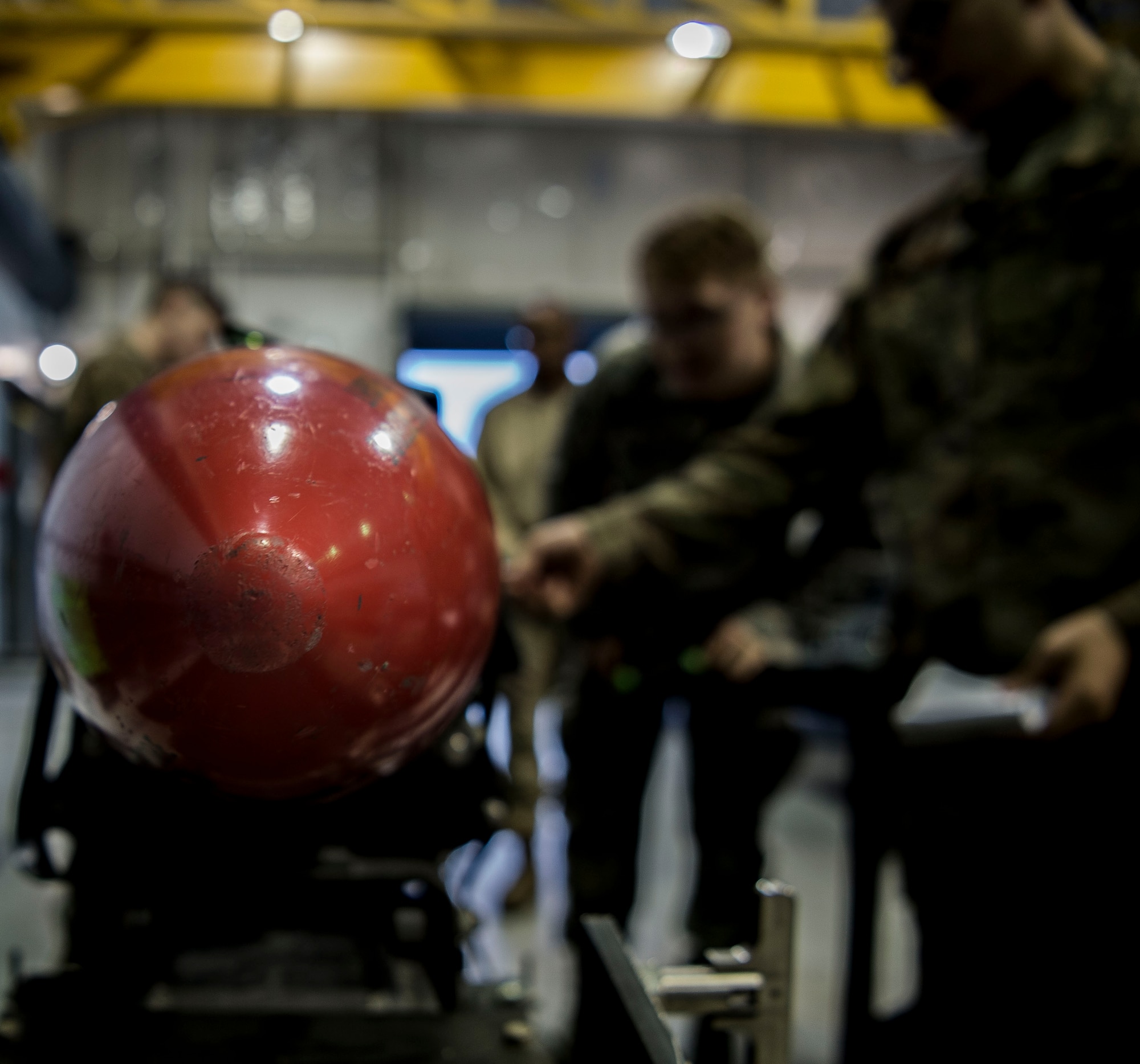 U.S. Airmen assigned to the 20th Equipment Maintenance Squadron (EMS) inspect an AGM-88 missile at Shaw Air Force Base, S.C., Nov. 30, 2018.