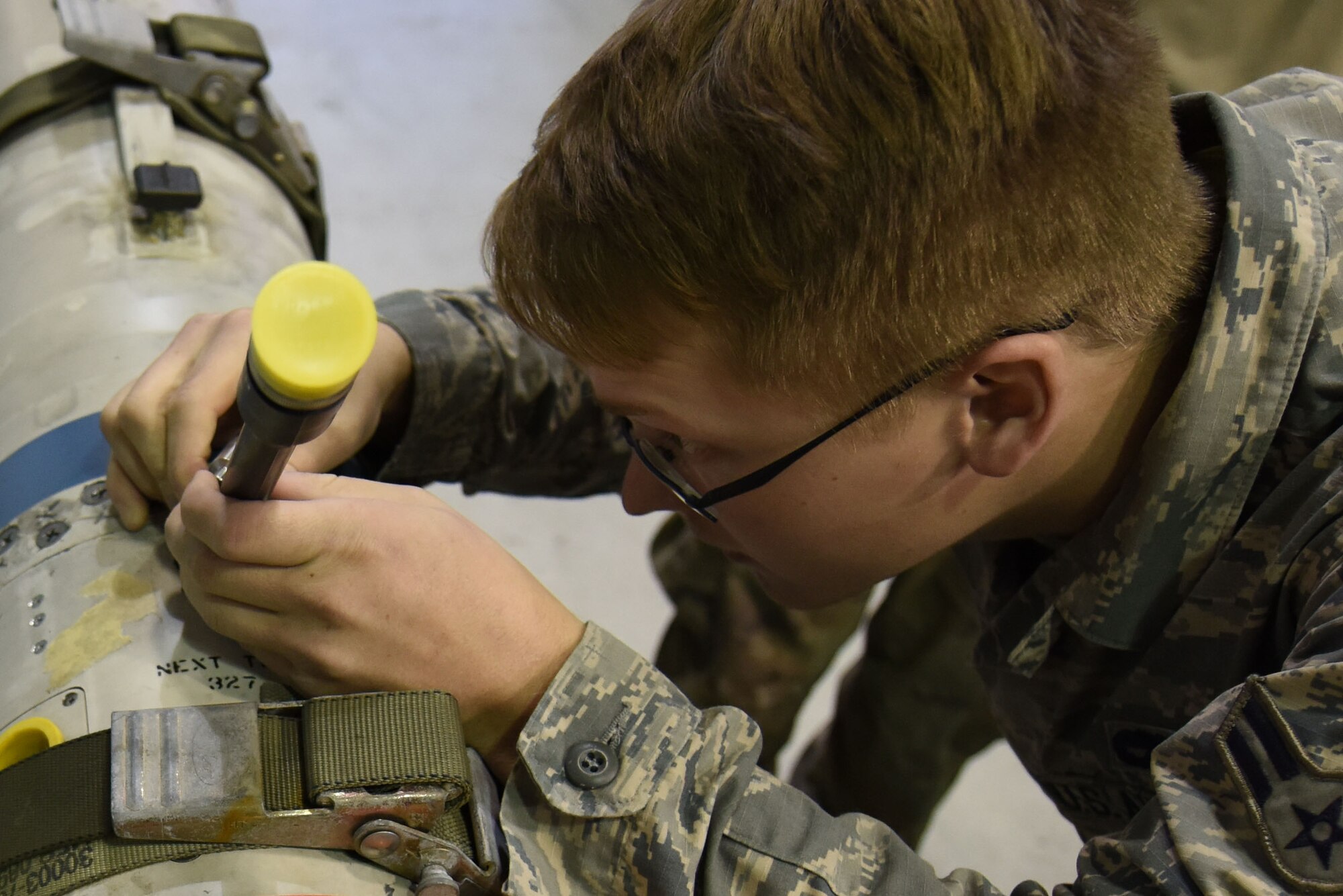 U.S. Air Force Airman 1st Class Dillon Richey, 20th Equipment Maintenance Squadron precision guided munition crew chief, checks a cable on an AGM-88 missile at Shaw Air Force Base, S.C., Nov. 30, 2018.