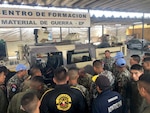 West Virginia Army National Guard Master Sgt. Ricky Baker discusses preventative maintenance checks and services of the M1165 HMMWV Nov. 28, 2018, with Peruvian Army maintenance personnel during a Subject Matter Expert Exchange (SMEE) Global Peace Operations Initiative (GPOI) mission held in Lima, Peru.