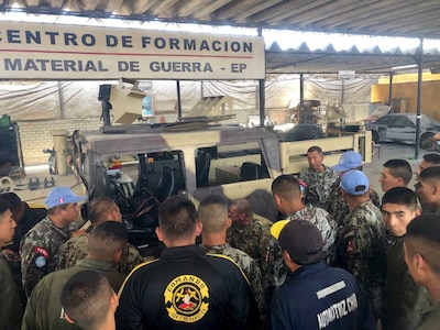 West Virginia Army National Guard Master Sgt. Ricky Baker discusses preventative maintenance checks and services of the M1165 HMMWV Nov. 28, 2018, with Peruvian Army maintenance personnel during a Subject Matter Expert Exchange (SMEE) Global Peace Operations Initiative (GPOI) mission held in Lima, Peru.