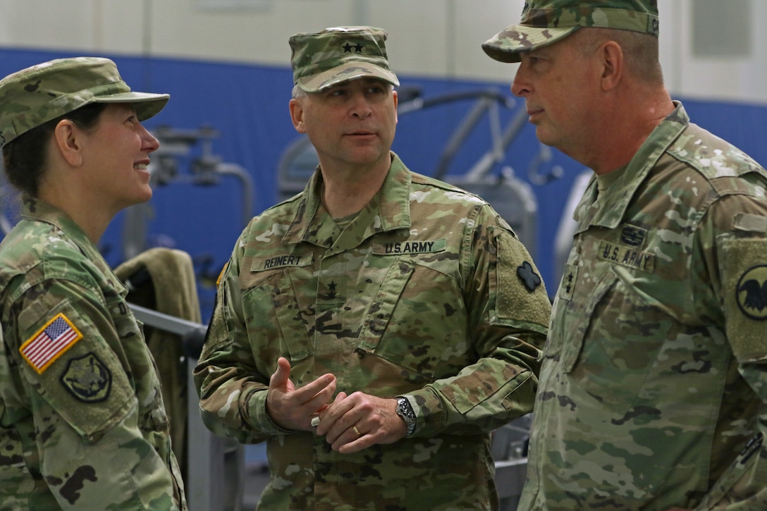 From left Maj. Gen. Jody J. Daniels, commanding general, 88th Readiness Division; Maj. Gen. Patrick J. Reinert, commanding general (outgoing), 88th Readiness Division; Maj. Gen. Scottie D. Carpenter, deputy commanding general, U.S. Army Reserve Command, talk backstage after the 88th Readiness Division change of command ceremony at Fort McCoy, Wisconsin, December 1, 2018.