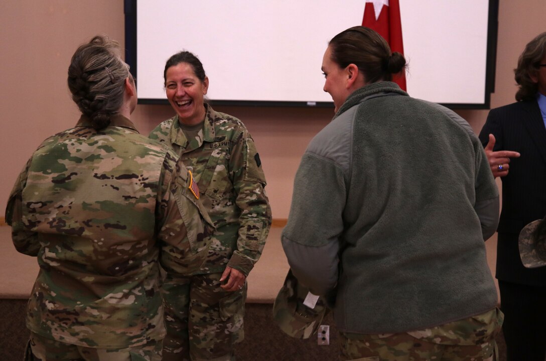 Maj. Gen. Jody J. Daniels, commanding general, 88th Readiness Division, greets Soldiers in a welcoming reception line after the change of command ceremony symbolizing her upcoming assumption of command at Fort McCoy, Wisconsin, December 1, 2018.