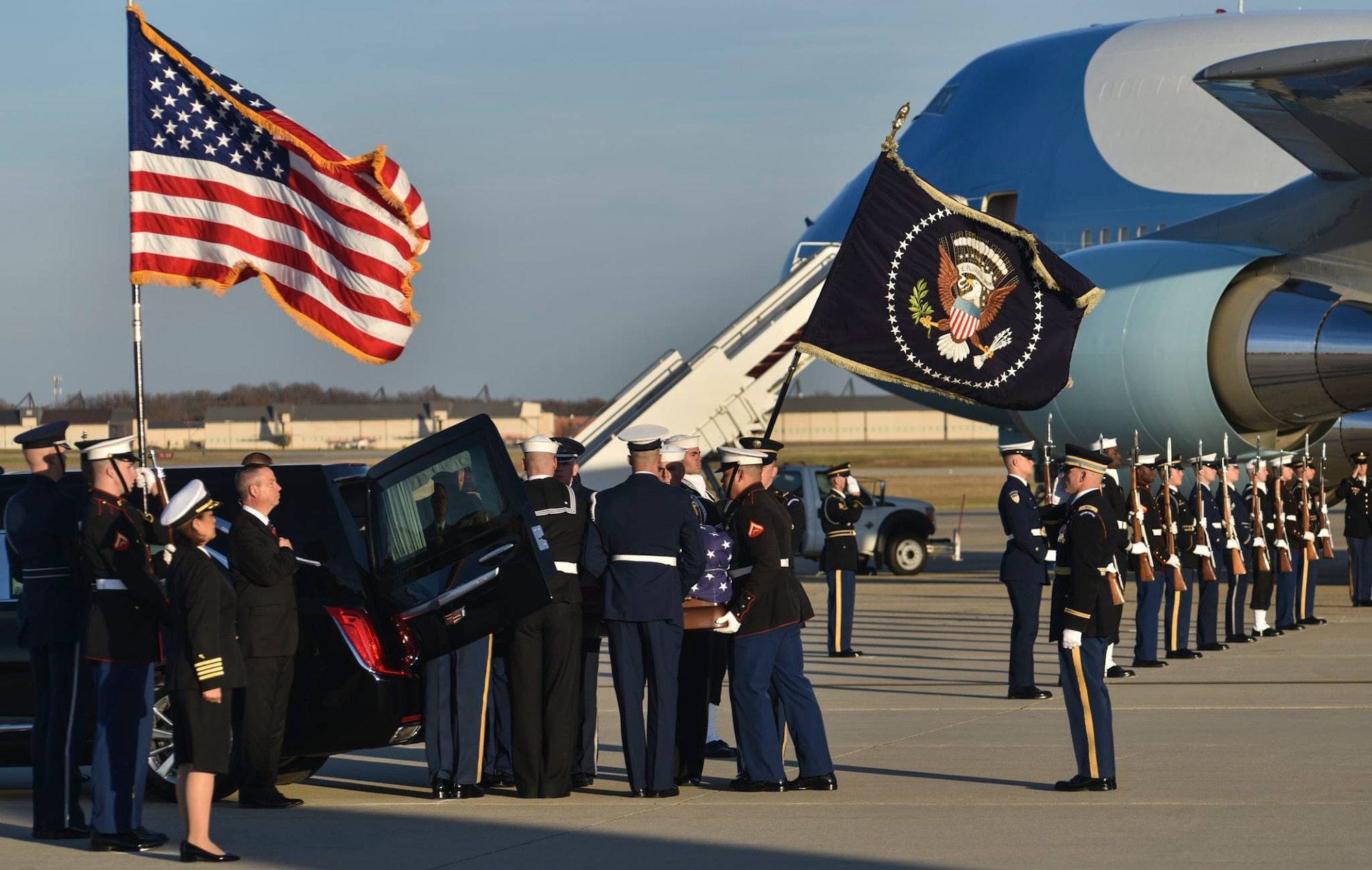 Members of the Joint Service Arrival Team place the casket of George W.H. Bush into a hearse on Joint Base Andrews, Md., Dec. 3, 2018.