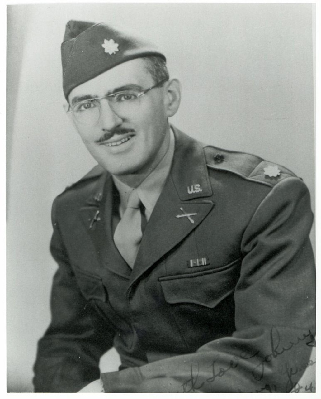 A black and white photo of a soldier.