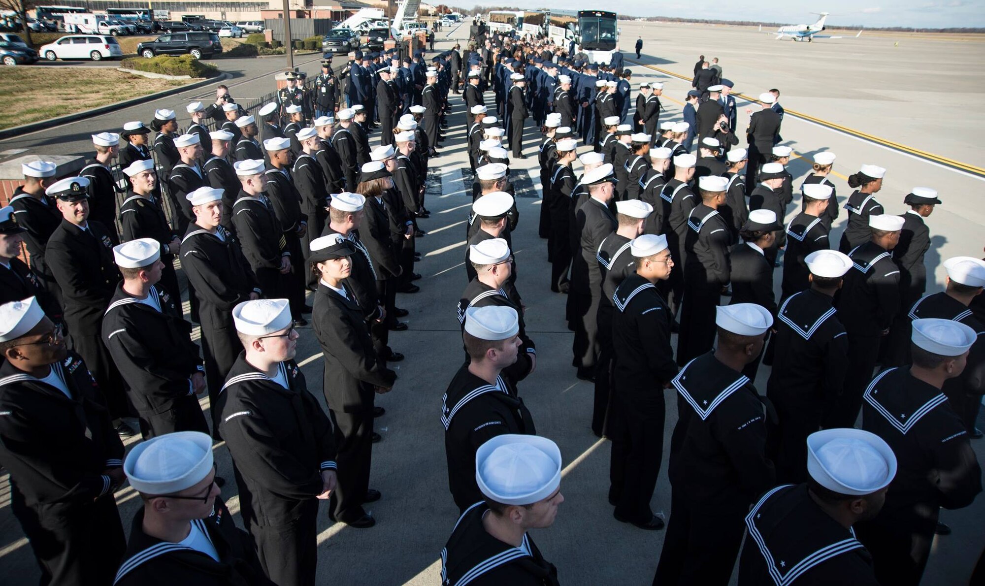 Sailors from the U.S.S. George H.W. Bush (CVN-77) stand at parade rest before the start of George H.W. Bush’s state funeral on Joint Base Andrews, Md., Dec. 3, 2018.