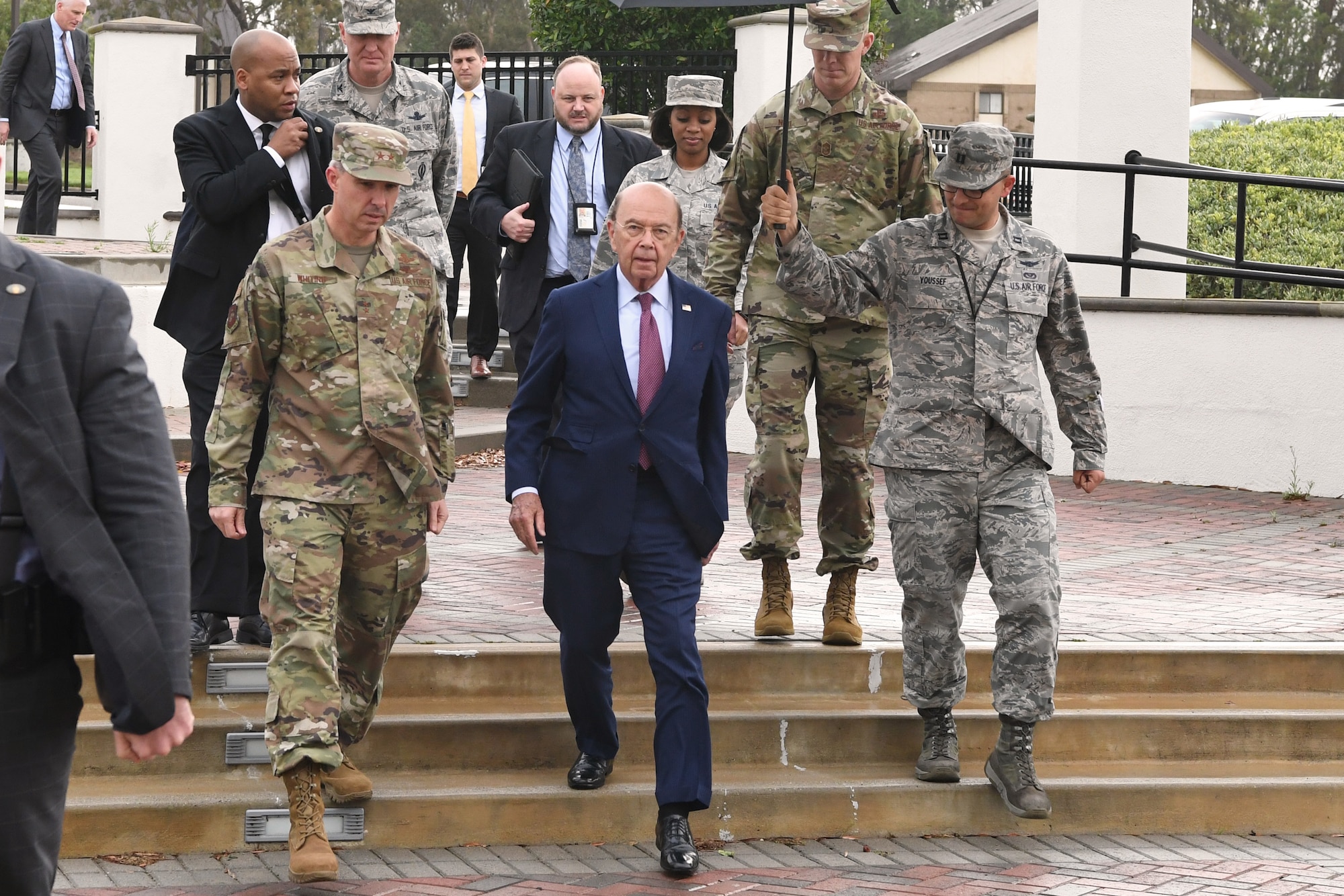 Deputy Joint Force Space Component Commander Maj. Gen. Stephen Whiting (left) walks with U.S. Secretary of Commerce Wilbur Ross (center) during a visit at Vandenberg AFB, Calif., Nov. 29, 2018. Secretary Ross met with service members from the 18th Space Control Squadron, Combined Space Operations Center, Joint Force Space Component Command and U.S. Strategic Command to discuss Space Situational Awareness capabilities and space operations during a visit here Nov. 29-30. Secretary Ross also spoke with service members about the Department of Defense transitioning non-military aspects of Space Situational Awareness and space safety monitoring and responsibilities to the Department of Commerce. (U.S. Air Force photo by Maj. Cody Chiles)