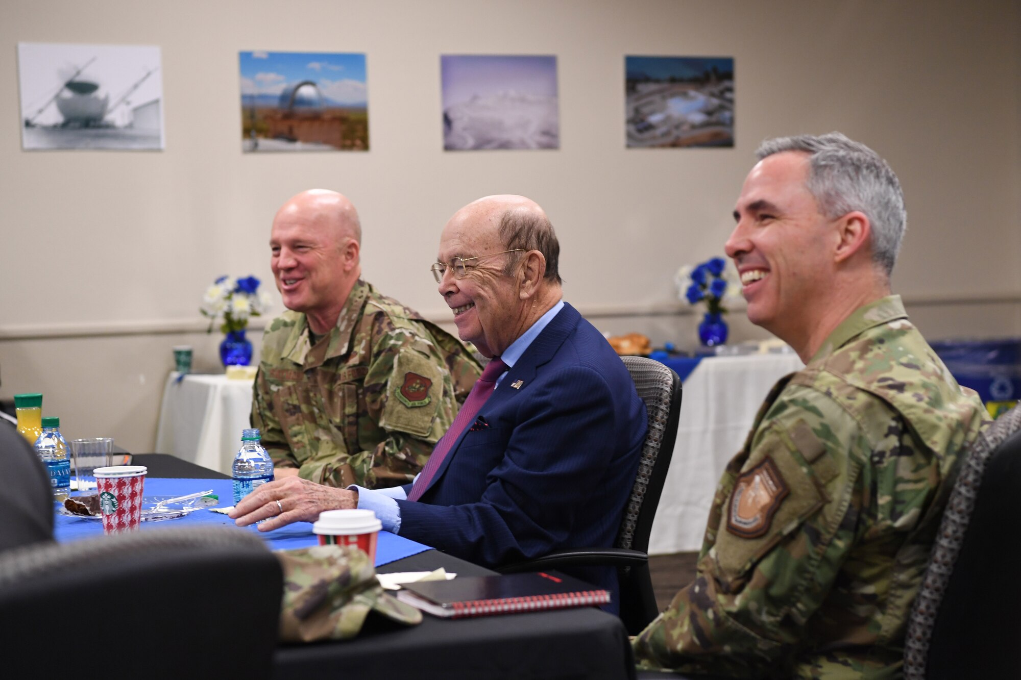 U.S. Secretary of Commerce Wilbur Ross (center), Joint Force Space Component Commander Gen. Jay Raymond (left), and Deputy Joint Force Space Component Commander Maj. Gen. Stephen Whiting (right) receiving a briefing about www.space-track.org in the Combined Space Operations Center at Vandenberg AFB, Calif., Nov. 30, 2018. Secretary Ross met with service members from the 18th Space Control Squadron, Combined Space Operations Center, Joint Force Space Component Command and U.S. Strategic Command to discuss Space Situational Awareness capabilities and space operations during a visit here Nov. 29-30. Secretary Ross also spoke with service members about the Department of Defense transitioning non-military aspects of Space Situational Awareness and space safety monitoring and responsibilities to the Department of Commerce. (U.S. Air Force photo by Maj. Cody Chiles)