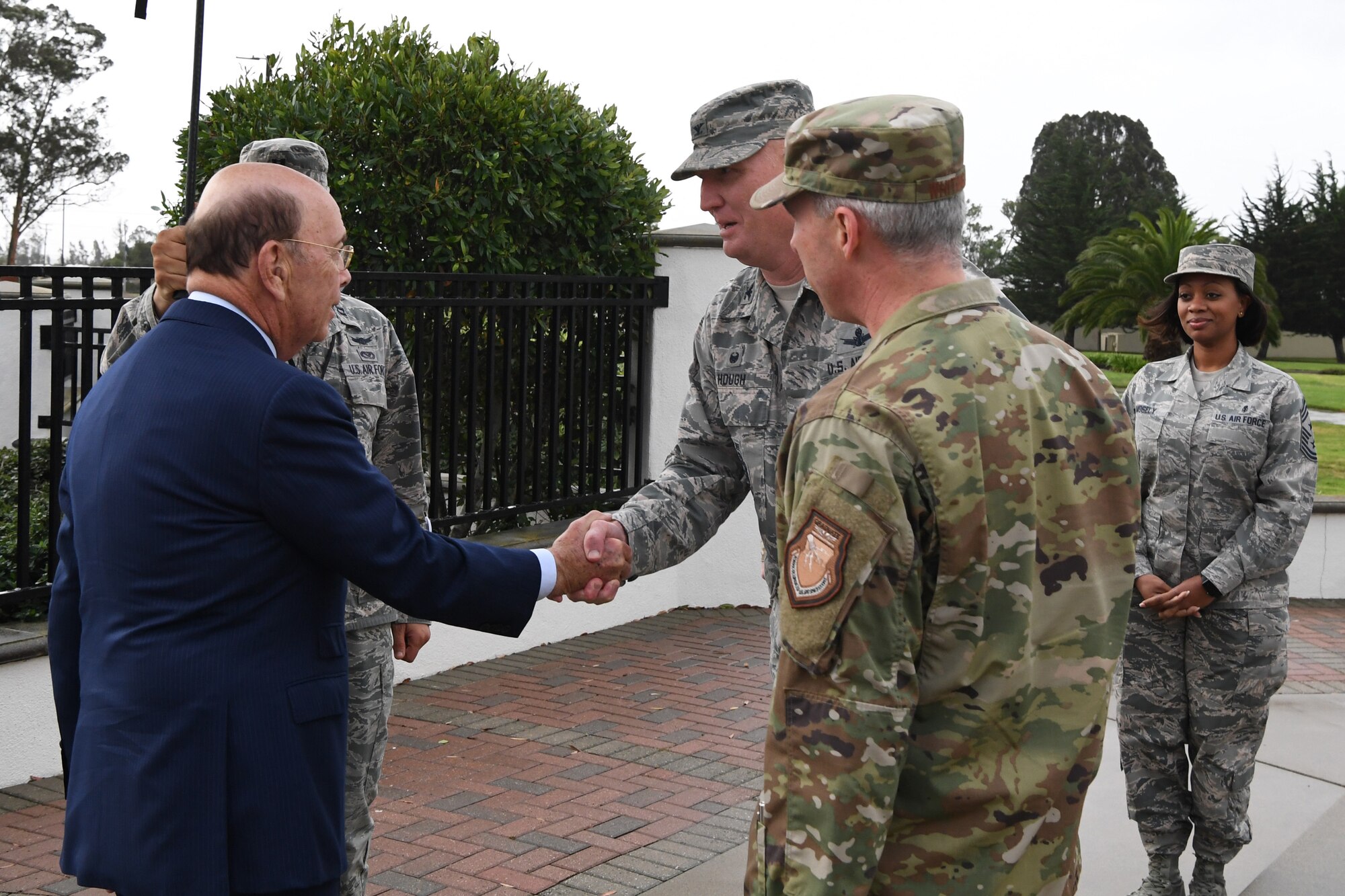 30th Space Wing Commander Col. Michael Hough (center) greets U.S. Secretary of Commerce Wilbur Ross (left) during a visit at Vandenberg AFB, Calif., Nov. 29, 2018. Secretary Ross met with service members from the 18th Space Control Squadron, 30th Space Wing, Combined Space Operations Center, Joint Force Space Component Command and U.S. Strategic Command to discuss Space Situational Awareness capabilities and space operations during a visit here Nov. 29-30. Secretary Ross also spoke with service members about the Department of Defense transitioning non-military aspects of Space Situational Awareness and space safety monitoring and responsibilities to the Department of Commerce. (U.S. Air Force photo by Maj. Cody Chiles)