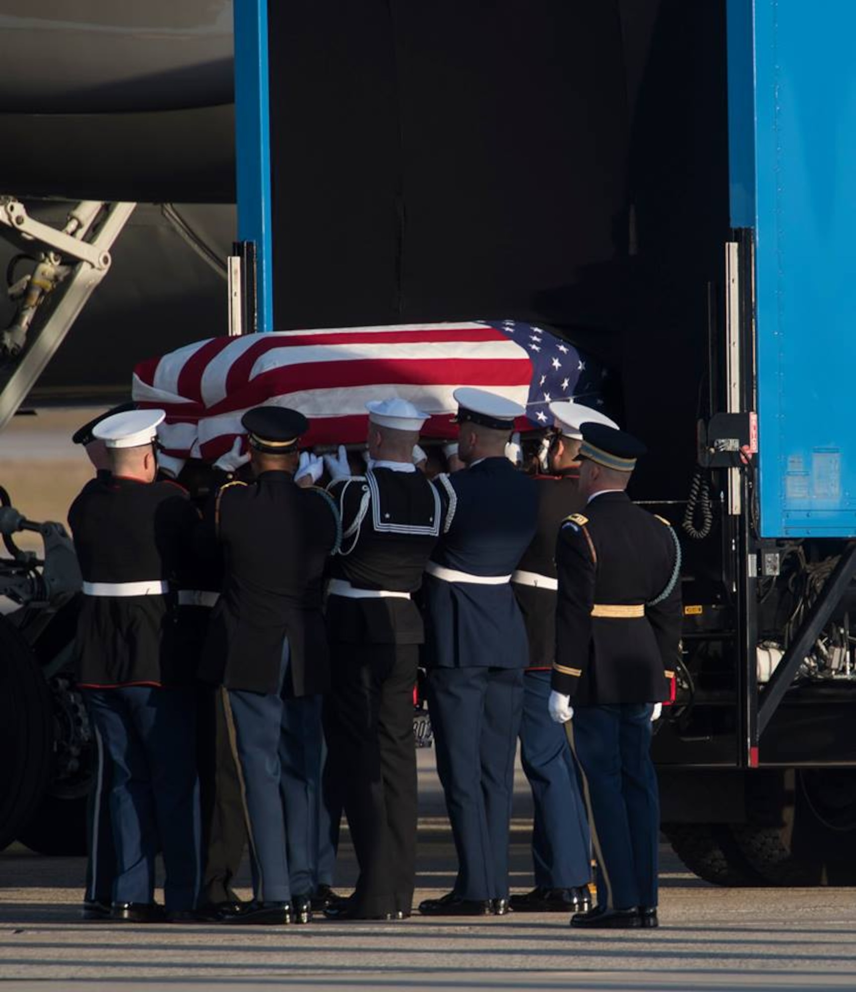 Members of the Joint Service Arrival Team carry the casket of George W.H. Bush on Joint Base Andrews, Md., Dec. 3, 2018.