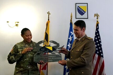 During a meeting in Sarajevo, Bosnia, U.S. Army Maj. Gen. Linda Singh, left, the adjutant general of the Maryland National Guard, presents Bosnia- Herzegovina army Lt. Gen. Senad Mašović, chief of the joint staff of the armed forces of Bosnia-Herzegovina, a gift commemorating the 15-year partnership between the Maryland Guard and the Bosnia-Herzegovina armed forces as part of the Department of Defense’s State Partnership Program, Nov. 28, 2018.