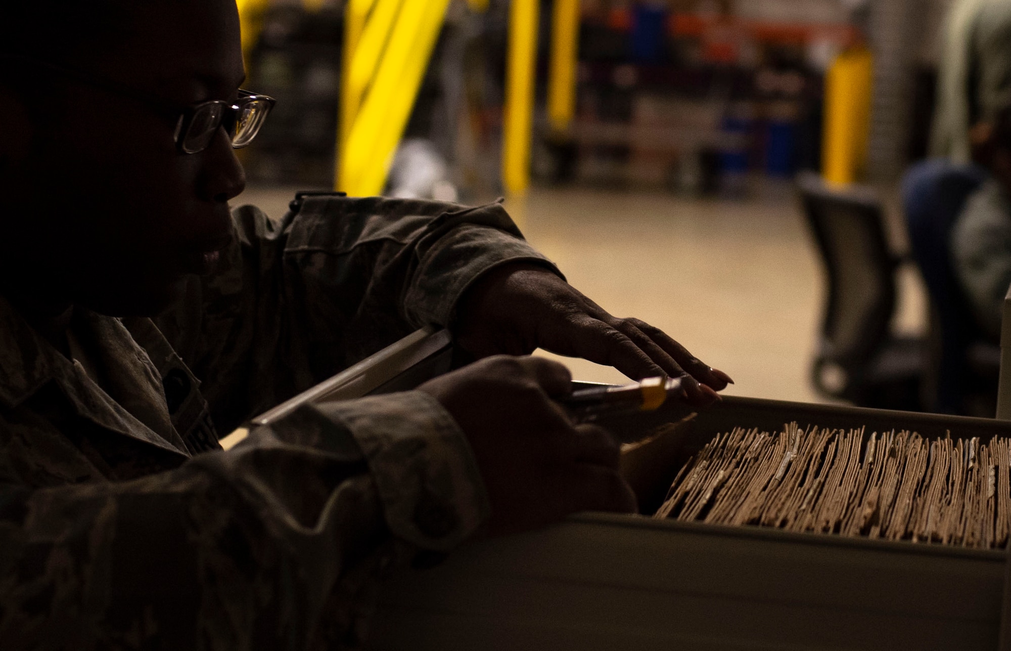 U.S. Air Force Senior Airman Shanice Smith, 20th Logistics Readiness Squadron individual protective equipment journeyman, sorts through customer gear logs at Shaw Air Force Base, S.C., Nov. 30, 2018.
