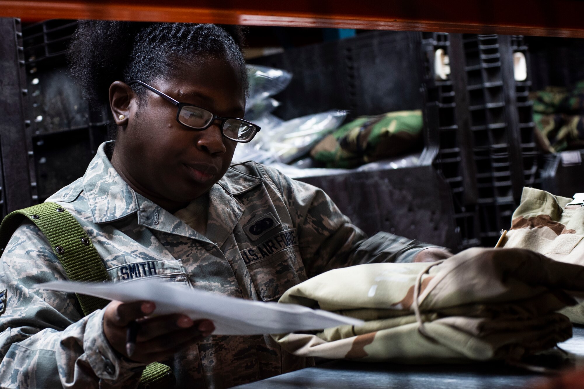U.S. Air Force Senior Airman Shanice Smith, 20th Logistics Readiness Squadron individual protective equipment (IPE) journeyman, searches for deployment gear at Shaw Air Force Base, S.C., Nov. 30, 2018.