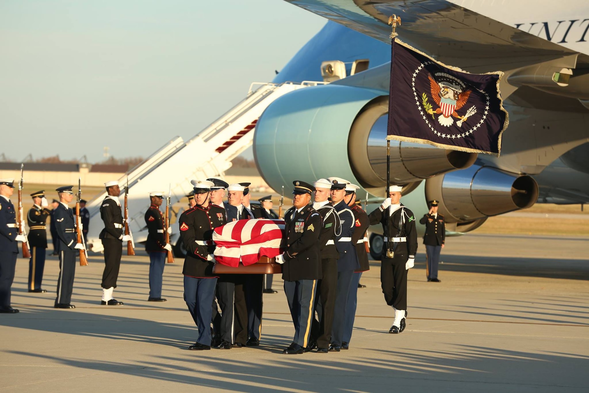 U.S. service members with the Ceremonial Honor Guard carry the casket of George H. W. Bush, the 41st President of the United States, at Andrews Air Base, Md., Dec. 03, 2018.