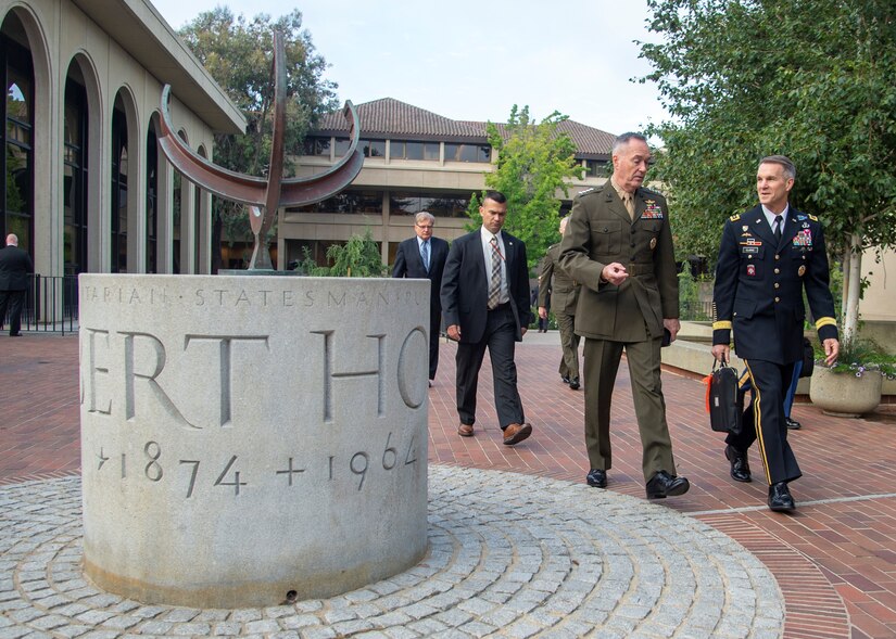 Marine Corps Gen. Joe Dunford, chairman of the Joint Chiefs of Staff, walks with Army Lt. Gen. Richard D. Clarke, director for strategic plans and policy on the Joint Staff, to the Australia-United States Ministerial Consultation at the Hoover Institute at Stanford University in Palo Alto, California.