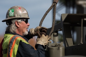 Ruben Golderos, contractor, unhooks a cable off of a M16 Multiple Gun Motor Carriage Half-track at the U.S. Army Transportation Museum at Joint Base Langley-Eustis, Virginia, Dec. 3, 2018.