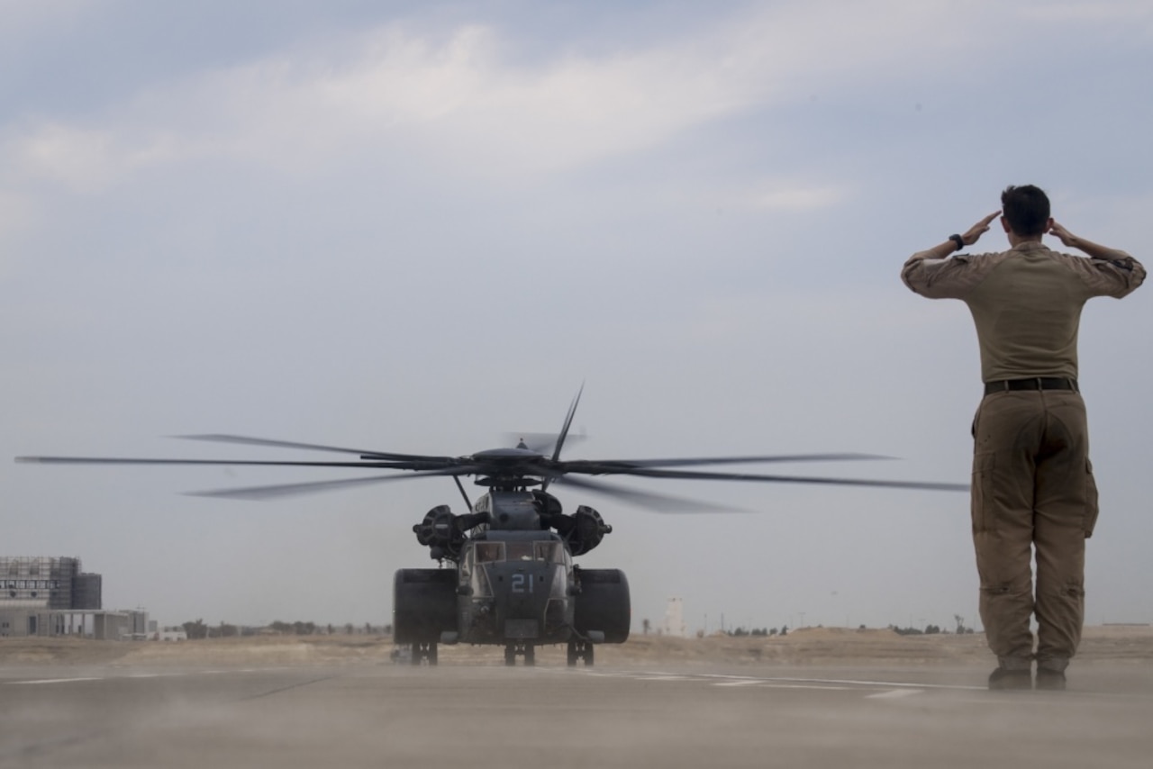 A Navy MH-53E Sea Dragon helicopter lands at Sakhir Air Base, Bahrain.