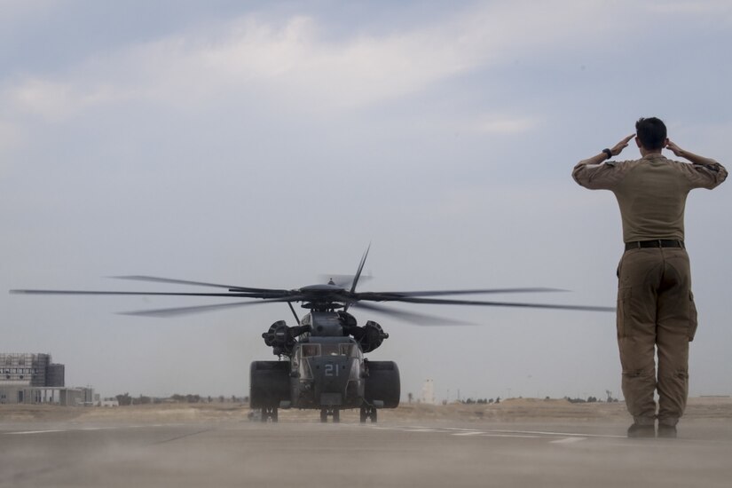 A Navy MH-53E Sea Dragon helicopter lands at Sakhir Air Base, Bahrain.