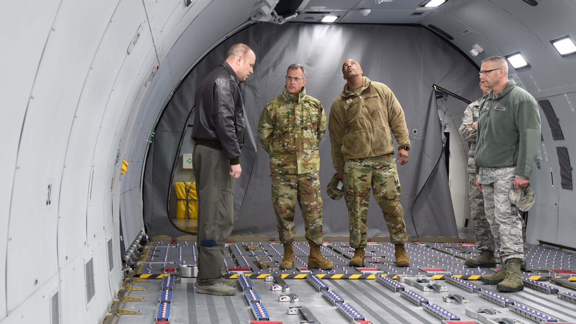 Maj. Gen. Randall A. Ogden, 4th Air Force commander, and Chief Master Sgt. Timothy White, 4th Air Force command chief, tour the KC-46 Fuselage Trainer Dec. 1, 2018, McConnell Air Force Base, Kan. The tour was followed by a trip to the KC-46 Simulator, where Ogden and White "flew" over Waikiki Beach.