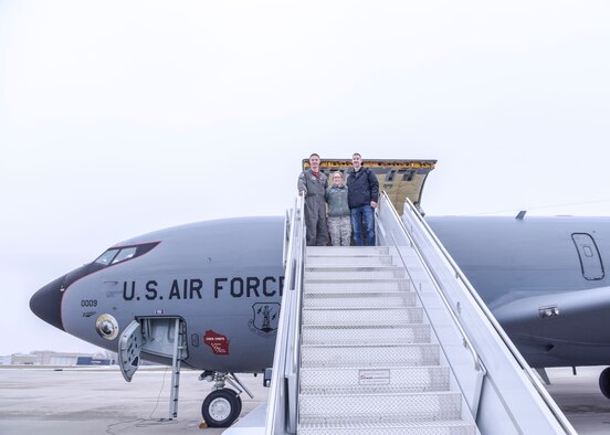 Lt. Col. James Sullivan, Lt. Col. Jessica Sullivan and Ted Sullivan board a KC-135. Spouses of 115th Fighter Wing Airmen were given the opportunity to fly along with 128th Air Refueling Wing crew members during a refueling training mission Nov. 30, 2018, Truax Field, Wis. While Lt. Col Jessica Sullivan had to stay behind, husband Ted Sullivan flew with brother Lt. Col. James Sullivan, evaluator pilot assigned to the 128th ARW and Pilot for this training mission. (U.S. Air National Guard photo by Tech. Sgt. Mary E. Greenwood)
