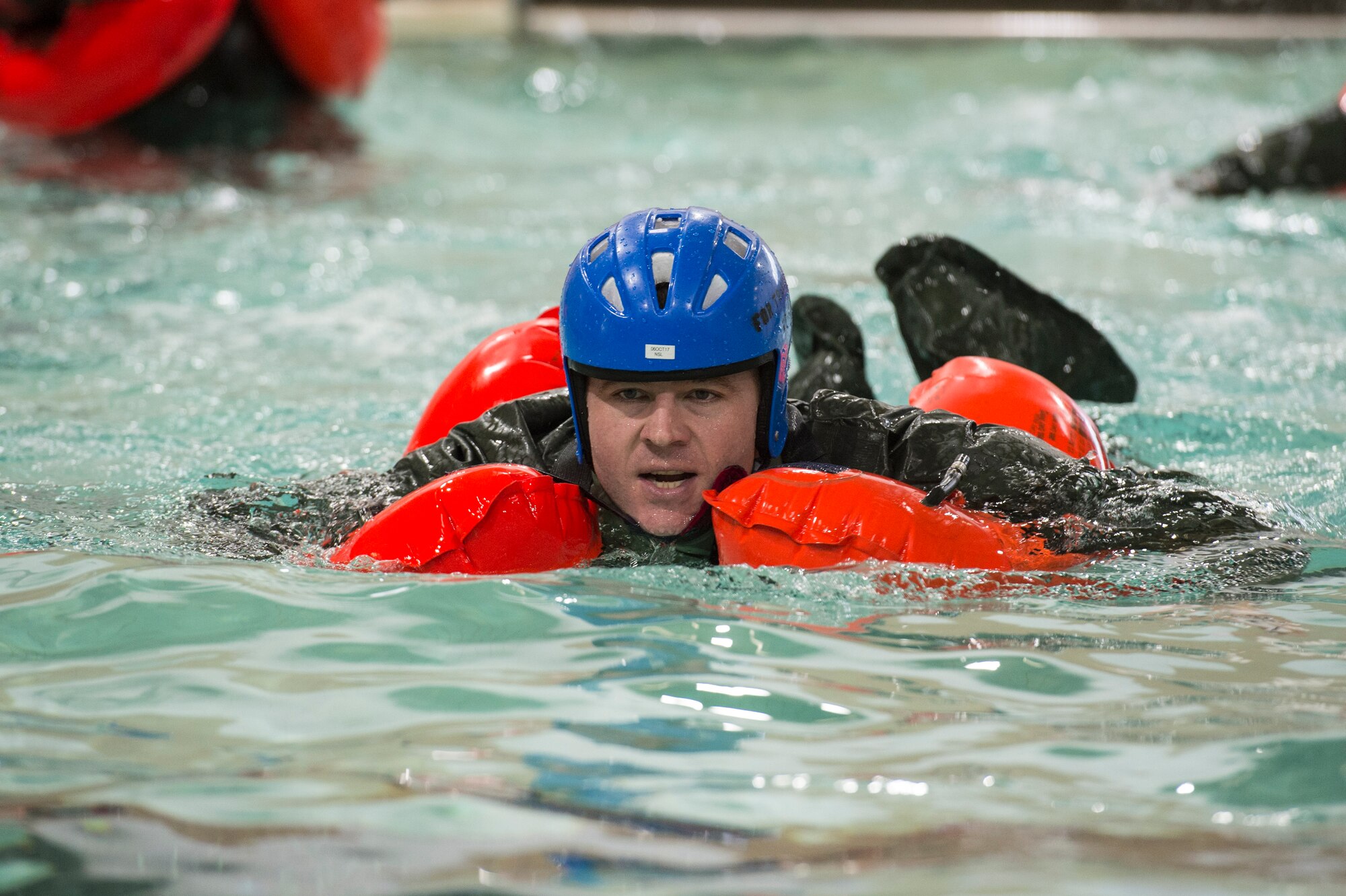 U.S. Air Force Senior Master Sgt. Pat Martin, a simulator certification boom operator assigned to the Air Mobility Command, practices his front crawl swimming stroke during a water survival refresher course,