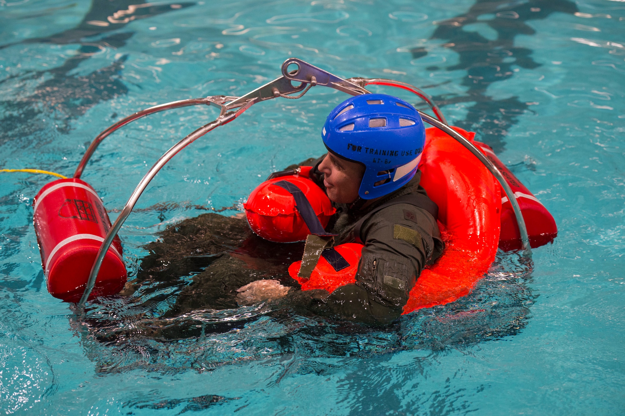 U.S. Air Force Maj. Timothy McBride, chief of wing tactics assigned to the 97th Operations Squadron, floats in a rescue device basket