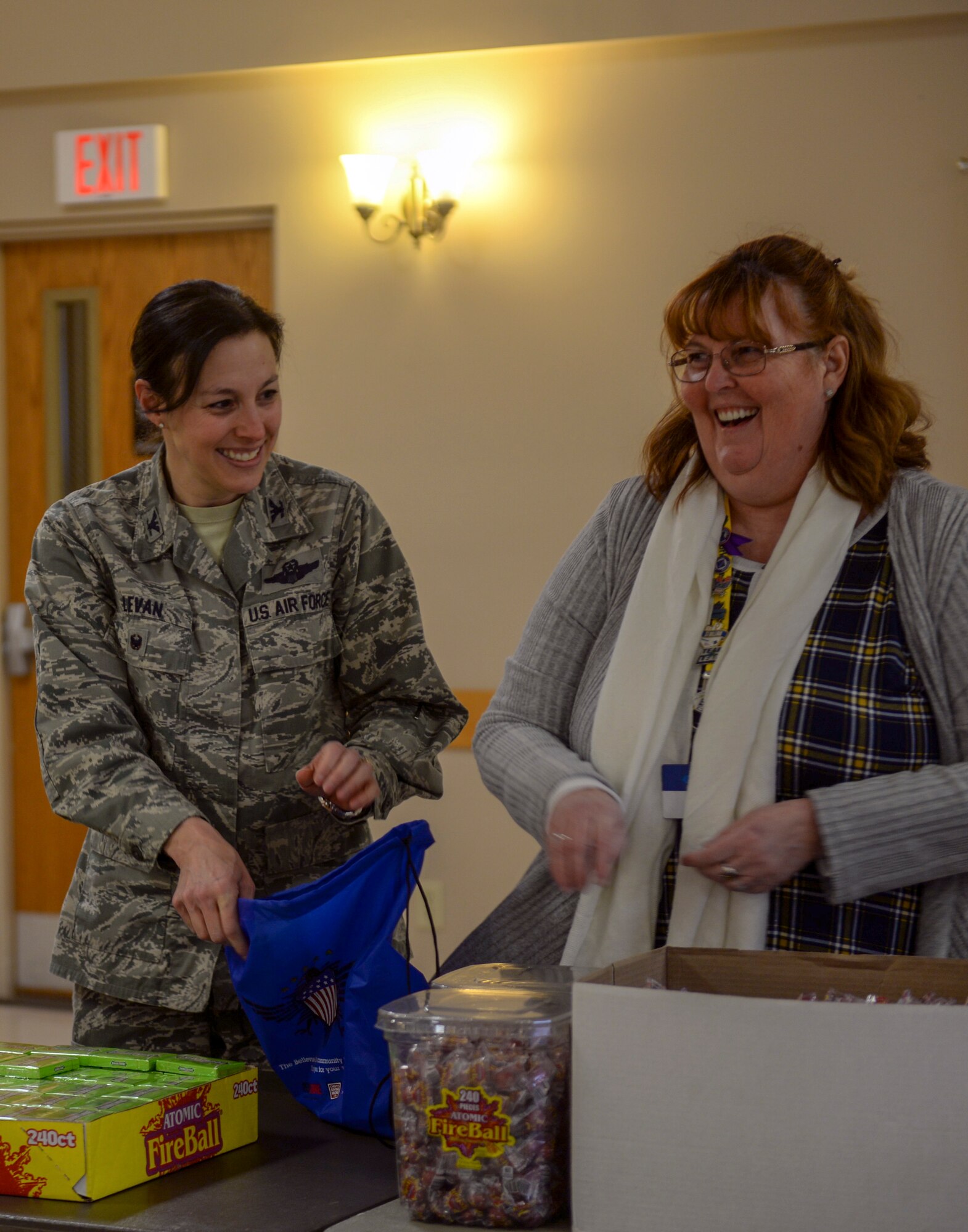 181204-F-IT794-1015 – Col. Sherri LeVan, 55th Wing vice commander, fills gift bags alongside members of the community at the Bellevue Volunteer Fire Department Dec. 6, 2018, as part as Operation Holiday Cheer. The Bellevue Chamber of Commerce started the program in 2003. (U.S. Air Force photo by Tech. Sgt. Rachelle Blake)