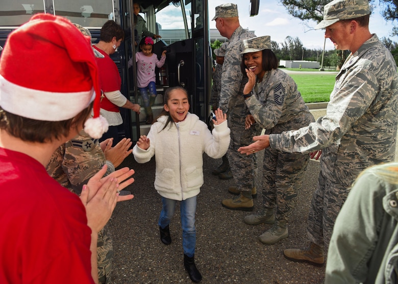 Team Vandenberg greets the children participating in Operation Kids Christmas, at the Pacific Coast Club at Vandenberg Air Force Base, Calif. Dec. 1, 2018. Vandenberg hosts the 59th annual Operation Kids Christmas here, expecting 200 kids from nearby cities to partake in the planned games, crafts, lunch and Christmas gifts.