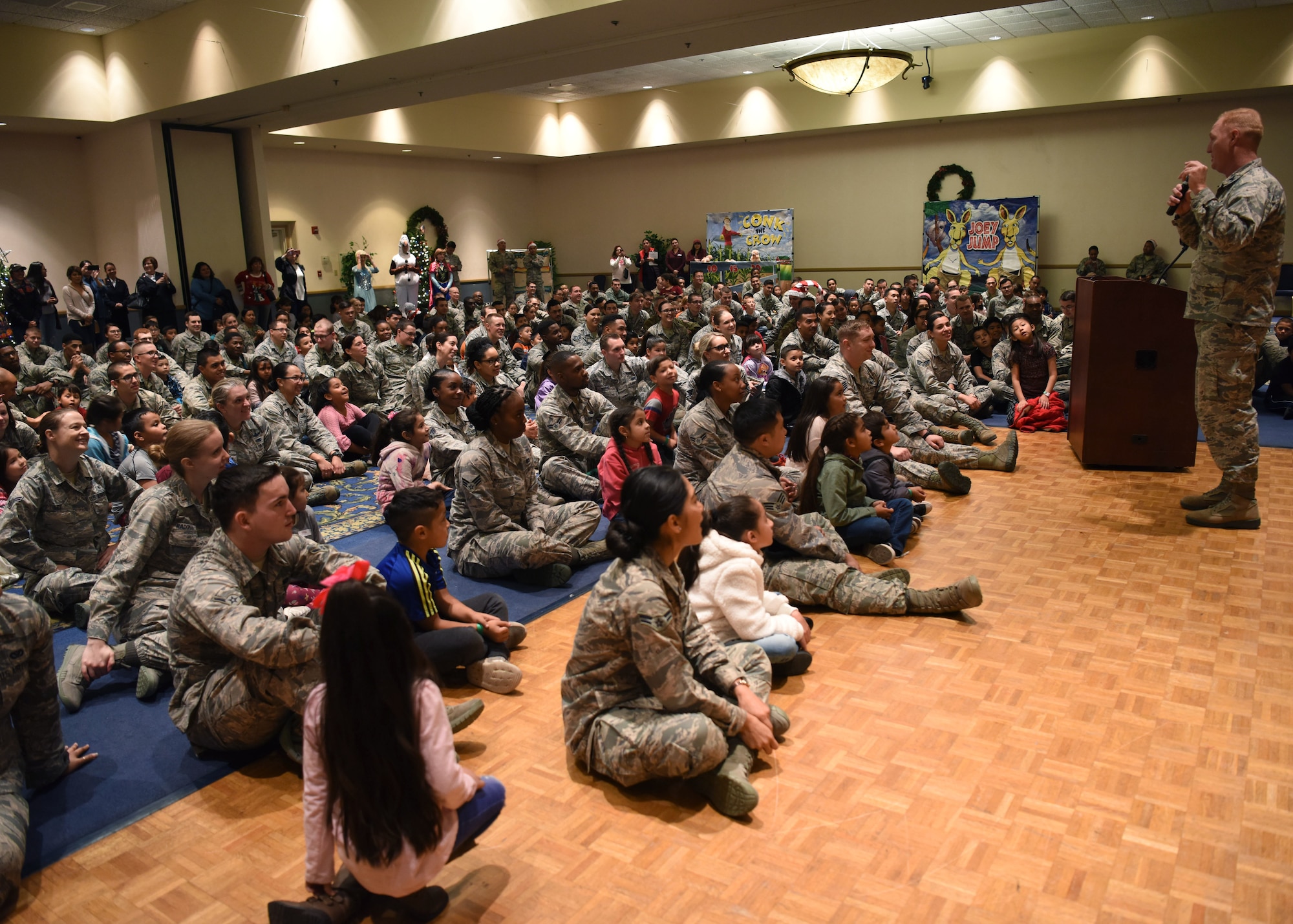 Col. Michael Hough, 30th Space Wing commander, greets the children to begin Operation Kids Christmas at the Pacific Coast club at Vandenberg Air Force Base, Calif. Dec. 1, 2018. Vandenberg hosts the 59th annual Operation Kids Christmas here, expecting 200 kids from nearby cities to partake in the planned games, crafts, lunch and Christmas gifts.