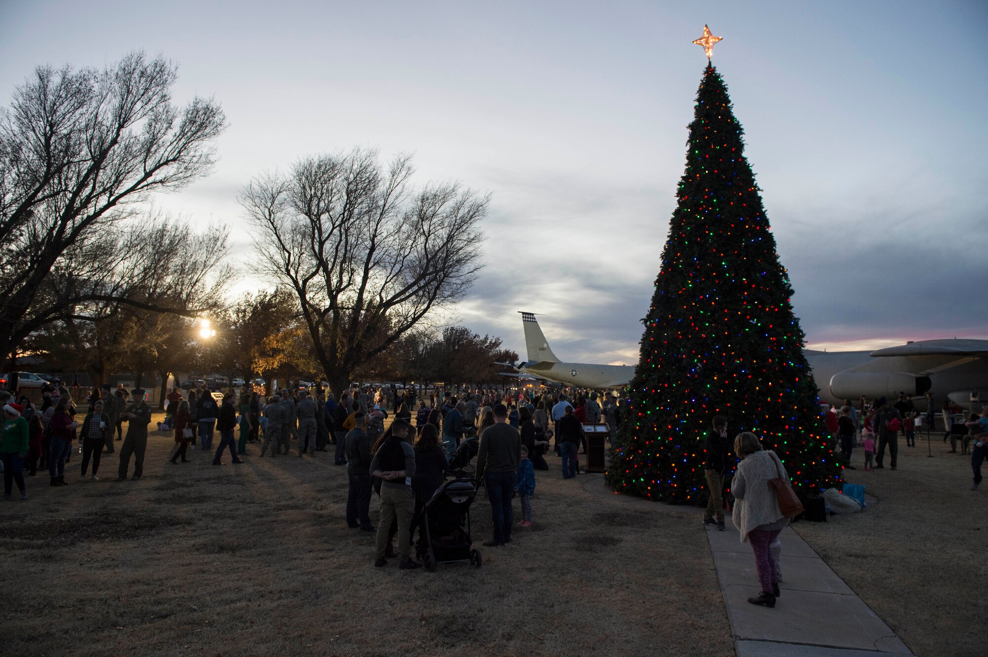 Members of the 97th Air Mobility Wing partake in festivities at the annual holiday tree lighting event, Nov. 29, 2018, at Altus Air Force Base, Okla. The event is hosted by the 97th Force Support Squadron in order to bring members of the military community together during the holidays. (U.S. Air Force photo by Senior Airman Cody Dowell)