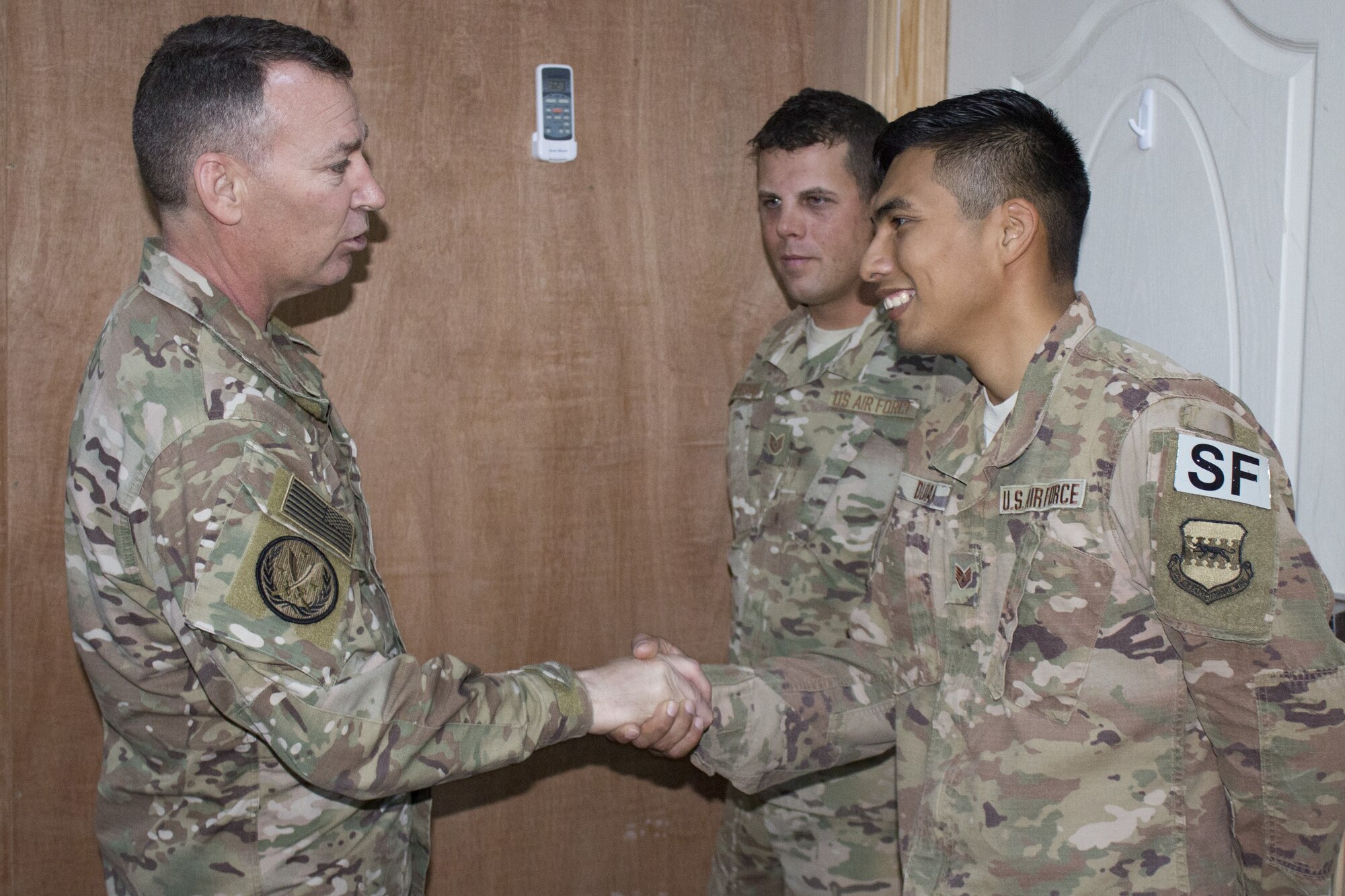 Maj. Gen. Chad Franks , Combined Joint Task Force-Operation Inherent Resolve deputy commander and 9th Air Expeditionary Task Force-Levant commander, expresses his gratitude to Staff Sgt. Kevin Duran, 332d Expeditionary Security Forces Squadron physical security NCO in charge, Dec. 2, 2018.  Franks met with 332d Air Expeditionary Wing top performers to thank them for their hard work and perseverance in support of operations.  Duran is from Scott Air Force Base, Ill. (U.S. Air Force photo by Maj. John T. Stamm)