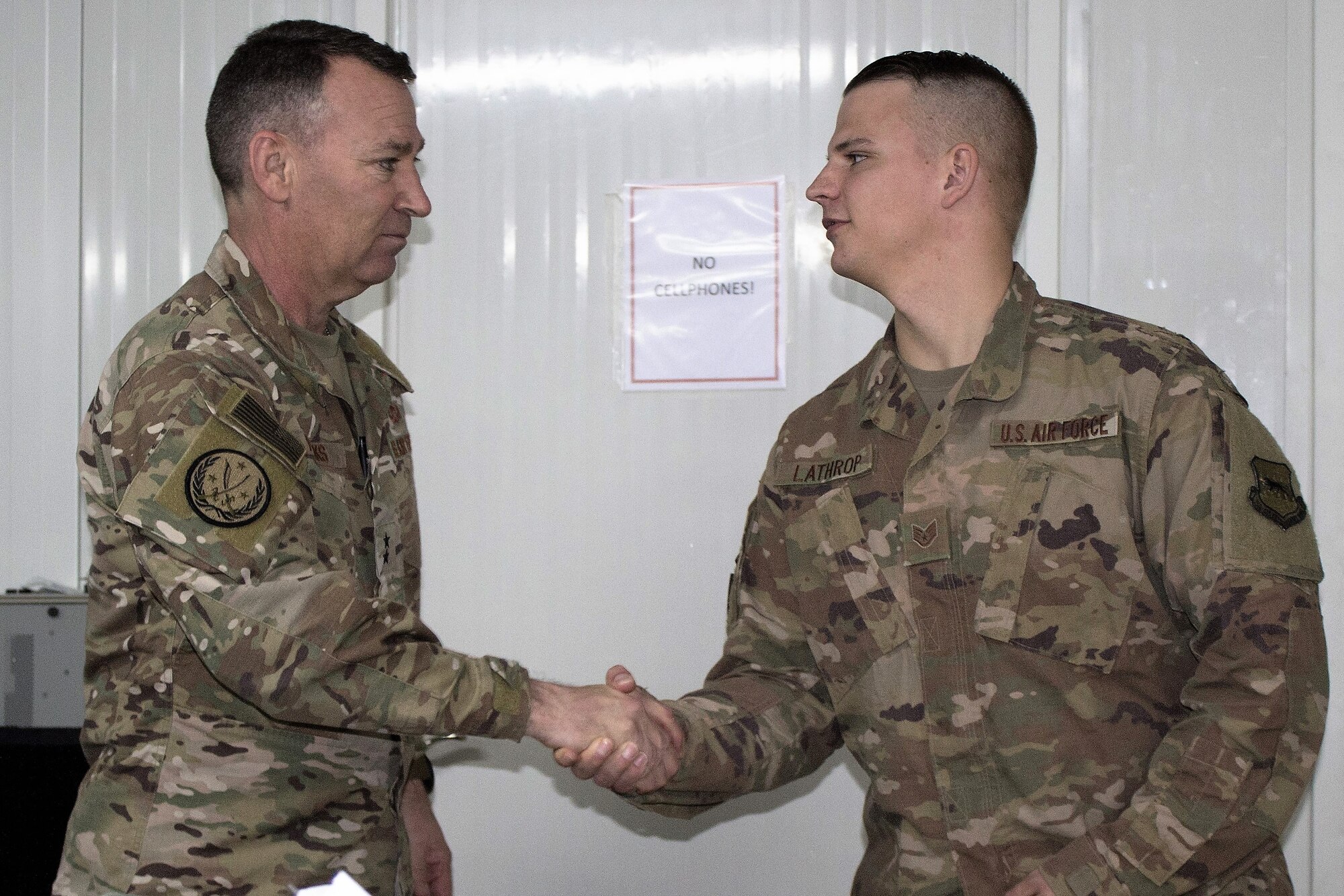 Maj. Gen. Chad Franks , Combined Joint Task Force-Operation Inherent Resolve deputy commander and 9th Air Expeditionary Task Force-Levant commander, expresses his gratitude to Staff Sgt. Richard Lathrop, 332d Expeditionary Operations Support Squadron air traffic control watch supervisor, Dec. 2, 2018.  Franks met with 332d Air Expeditionary Wing top performers to thank them for their hard work and perseverance in support of operations.  Lathrop is from White Sands Missile Range, N.M. (U.S. Air Force photo by Maj. John T. Stamm)