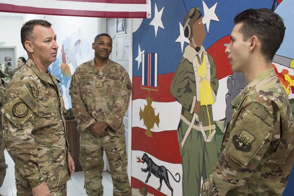 Maj. Gen. Chad Franks , Combined Joint Task Force-Operation Inherent Resolve deputy commander and 9th Air Expeditionary Task Force-Levant commander receives a status briefing from Senior Airman Sebastian Myers, 332d Air Expeditionary Wing Command Post controller, Dec. 2, 2018.  Franks met with 332d AEW top performers to thank them for their hard work and perseverance in support of operations. Myers is from Patrick Air Force Base, Fla. (U.S. Air Force photo by Maj. John T. Stamm)