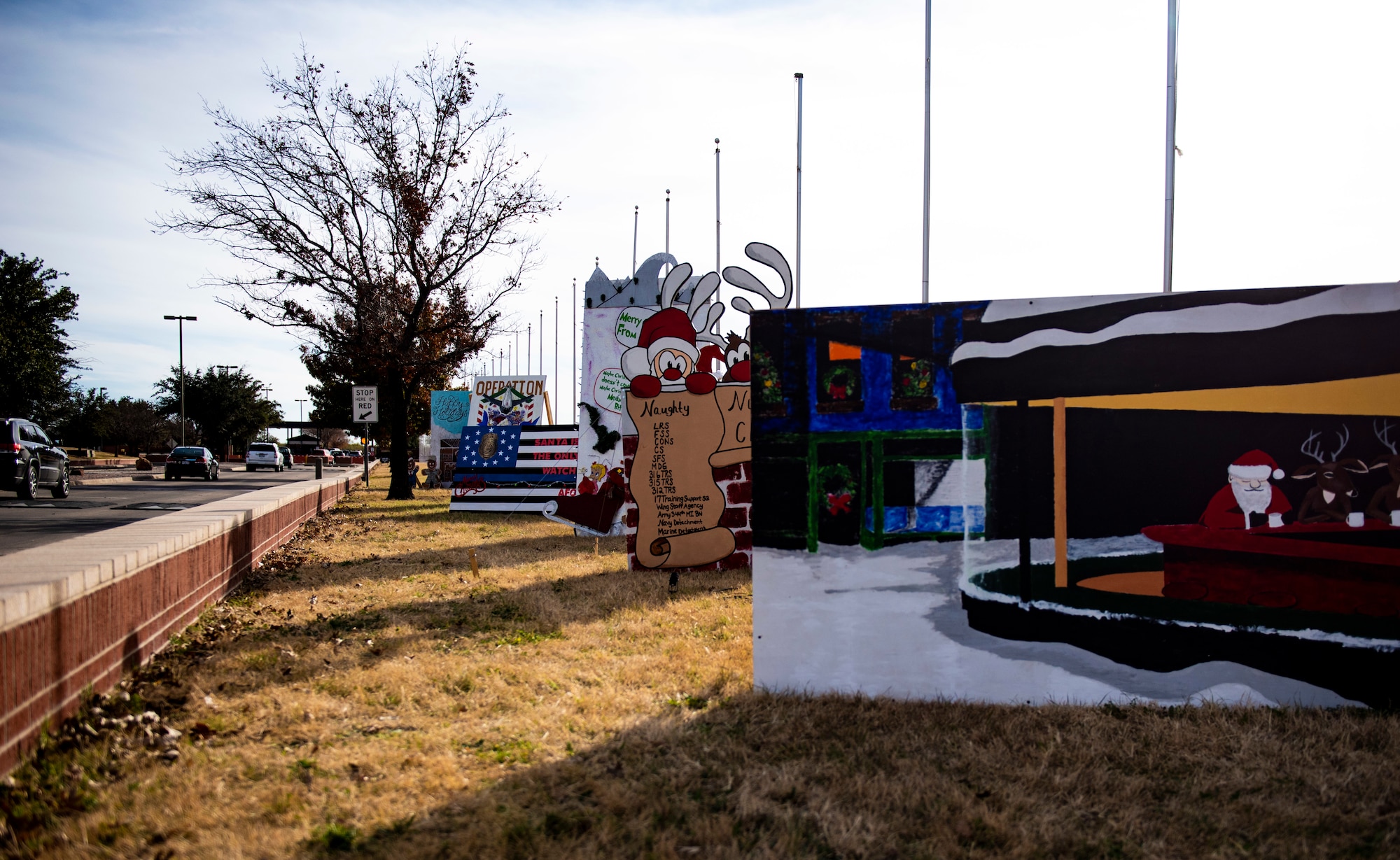 Holiday cards on display at the south gate for the 30th annual Holiday Card contest on Goodfellow Air Force Base, Texas, Dec. 3, 2018. The Holiday Card challenges Goodfellow agencies to make a 04creative card to celebrate the holidays. (U.S. Air Force photo by Senior Airman Scott Jackson/Released)