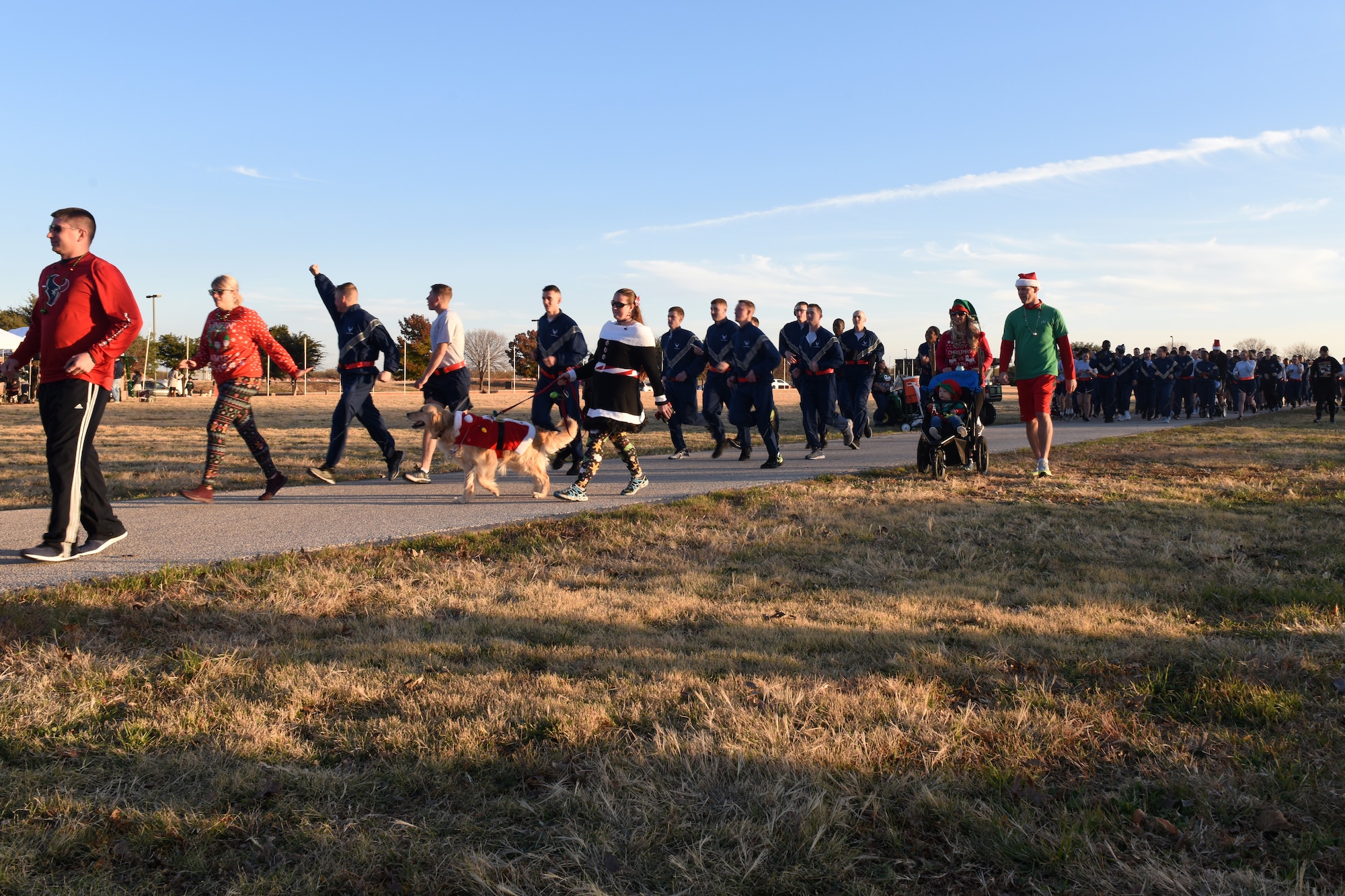Participants in the Jingle Bell 5K start their run Prior to the Tree Lighting Ceremony at the parade field at Goodfellow Air Force Base, Texas, Dec. 4, 2018. The run was open to the squadrons on base who used the event as physical training and a way to boost morale, it was also open to those who had base access. (U.S. Air Force photo by Airman 1st Class Zachary Chapman/Released)