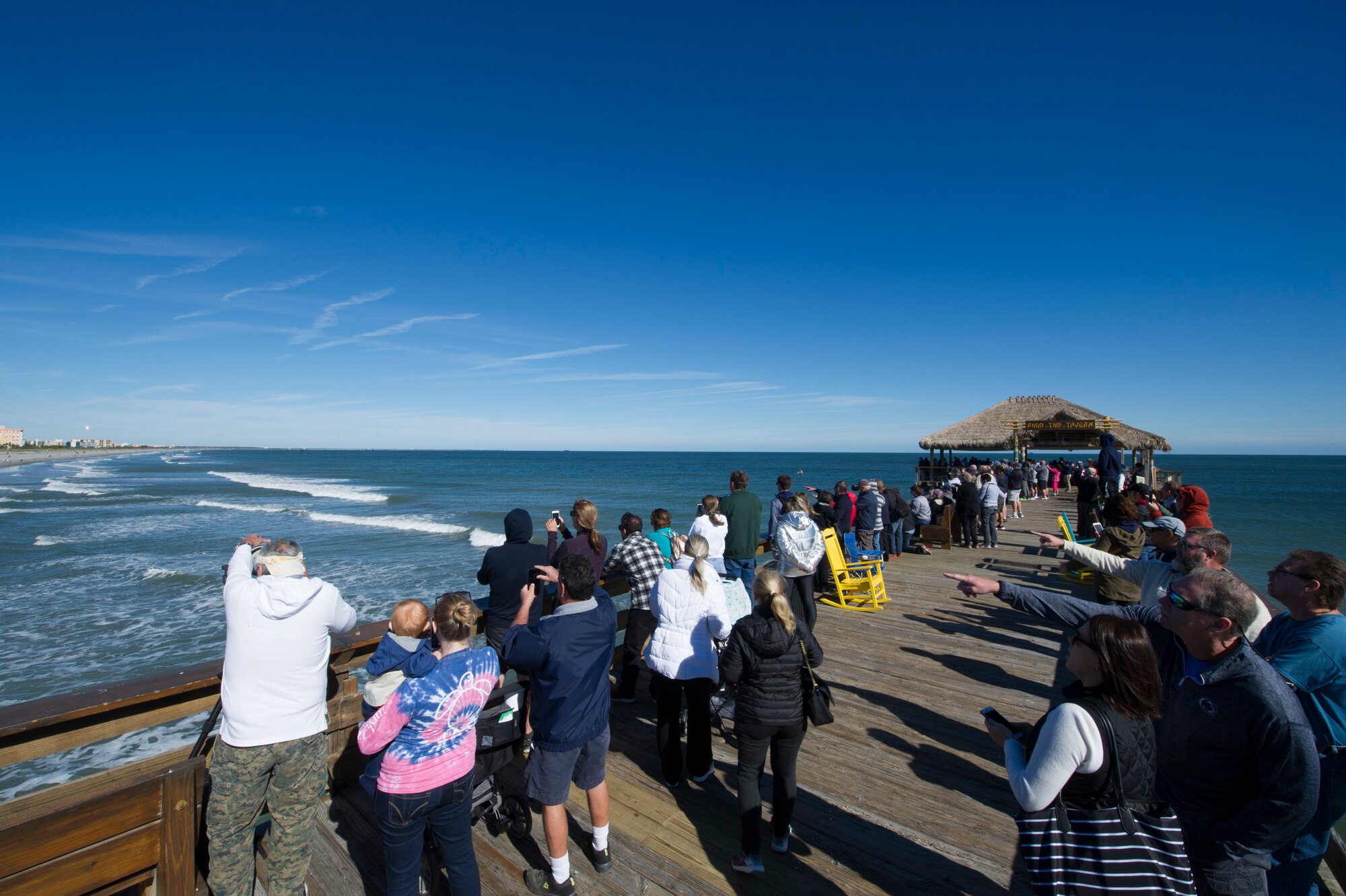 People watch SpaceX's Falcon 9 rocket CRS-16 lift off from Cape Canaveral Air Force Station, Space Launch Complex 40 on Dec 5, 2018 at Cocoa Beach, Fla. The CRS-16, a cargo resupply mission to the International Space Station, carried more than 5,600 pounds of supplies to the ISS, including 250 research and science projects. (U.S. Air Force photo by Airman 1st Class Dalton Williams)