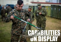 U.S. Navy Hospital Corpsman 2nd Class John Bustamante handles a habu snake during a preventive medicine course as part of a capabilities display Nov. 29, 2018 at Camp Foster, Okinawa, Japan. The preventive medicine snake relocation course allowed Sailors to practice safely relocating reptiles from areas where they pose a threat. Sailors with 3rd Medical Battalion, 3rd Marine Logistics Group, established a Role II capabilities display to give service members the opportunity to view their full facilities. Preventive medicine technicians displayed and offered courses on their food and water sanitation test, snake relocation and entomology surveillance capabilities. Bustamante, a corpsman with 3rd Medical Bn., 3rd MLG, is a native of Killeen, Texas. (U.S. Marine Corps photo by Lance Cpl. Mark Fike)