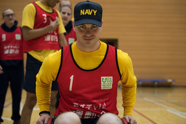 U.S. Navy Petty Officer 2nd Class Wayne Swindell, a Naval Air Facility security department watch commander, pushes himself in a wheelchair during the Misawa City Paralympics tribute game at the Misawa International Sports Center in Misawa City, Japan, Dec. 1, 2018. Kazumasa Taneichi, the Misawa City mayor, invited Misawa Air Base military members to participate in a Paralympic event in honor of the official Paralympics in Tokyo in 2020. (U.S. Air Force photo by U.S. Navy Petty Officer 2nd Class Bryan Mai)