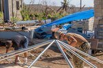 Commonwealth of the Northern Marianas Islands (Nov. 7, 2018) Engineering Aide Constructionman Cameron Tanner, assigned to Naval Mobile Construction Battalion 1, erects a FEMA-provided tent for a Tinian family whose home was destroyed by Super Typhoon Yutu. Service members from Joint Region Marianas and Indo-Pacific Command are providing Department of Defense support to the Commonwealth of the Northern Mariana Islands' civil and local officials as part of the FEMA-supported Super Typhoon Yutu recovery efforts.