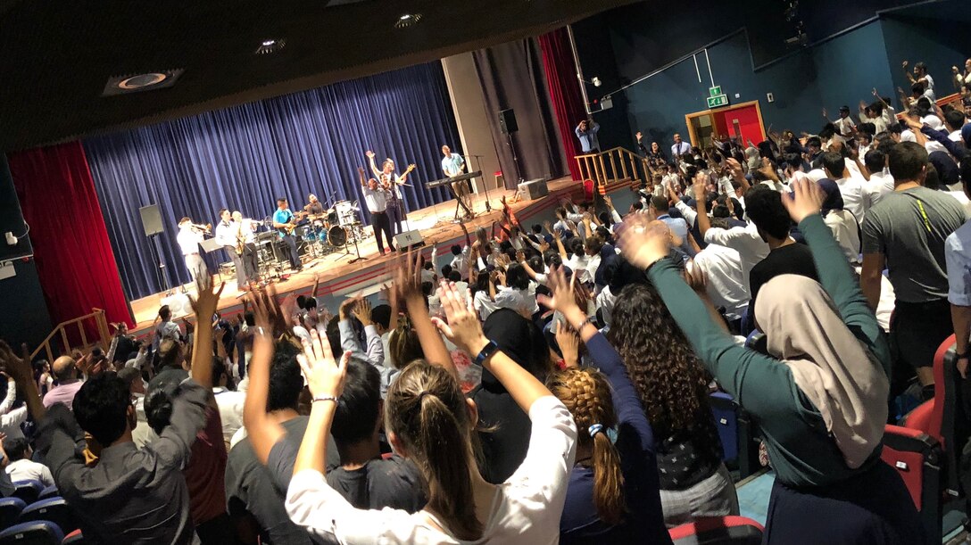 Students at a school in Duhkan, Qatar dance and enjoy a performance by the U.S. Air Forces Central Command Band Oct. 9, 2018. The AFCENT Band has an outreach mission to engage communities in efforts to develop relationships on behalf of AFCENT and the United States Air Force. (U.S. Air Force photo by Capt. Dustin Doyle)